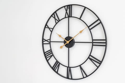 Living Room | Stylish Black Metal Clock Mounted on the Wall