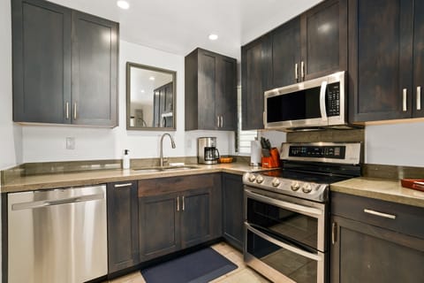 4305 Kitchen has everything you need, including dishwasher, microwave, stove, double oven, full-size refrigerator + freezer, garbage disposal, coffee maker, and blender