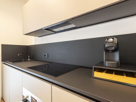 Kitchen, Interior Design, Countertop, Kitchen Appliance, Home Appliance, Kitchen Stove, Room, Major Appliance, Cabinetry