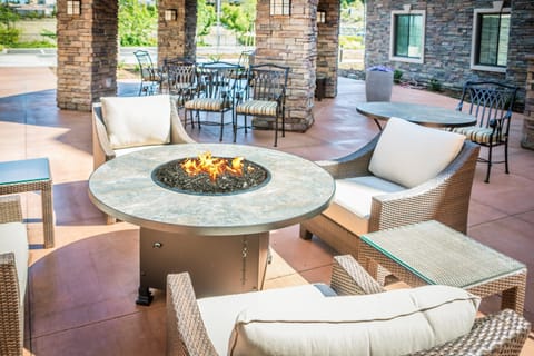 Share laughs around the outdoor fire pit with your group.
