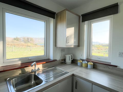 Honeybee Cottage Valentia Co Kerry. Bright kitchen with views to garden.