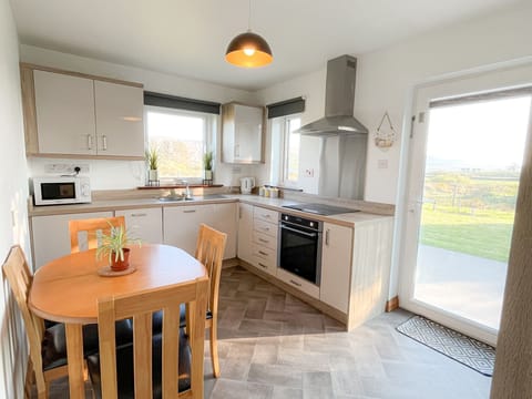 Honeybee Cottage Valentia. Self catering holiday home Co. Kerry. Bright kitchen, views to garden.