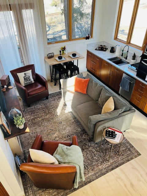 View down to open plan living area and kitchen from the downstairs loft 