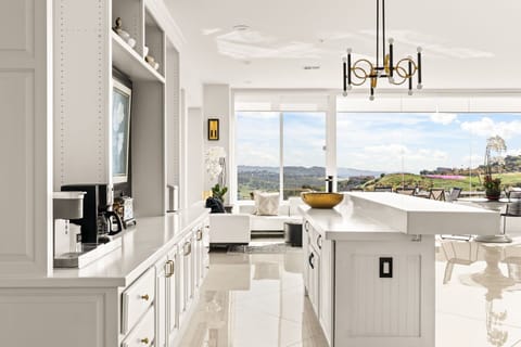 Second half of the kitchen includes a coffee maker and extra storage.