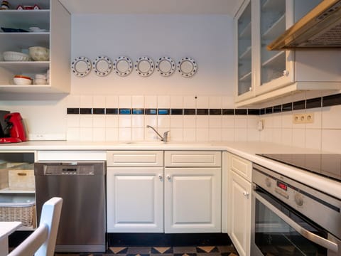 Kitchen, Countertop, Flooring, Interior Design, Cabinetry, Kitchen Appliance, Floor, Major Appliance, Tile, Lighting