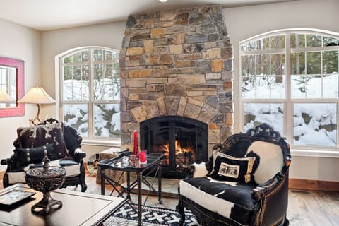 Cozy Living Room with Wood Burning Fireplace and TV with Cable