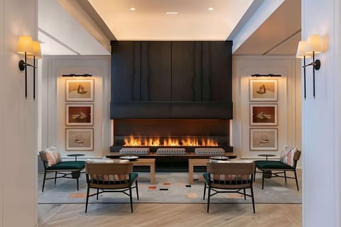 Unwind fireside with warm lighting and intimate seating.