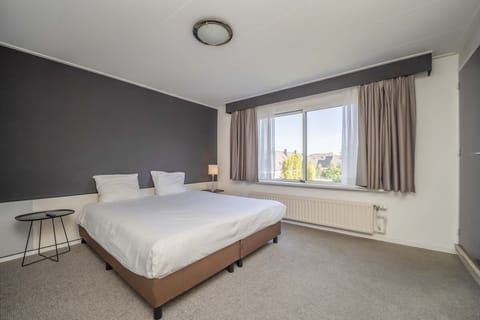 Unit with 1 Double bed and 3 Single beds. Exact unit will be assigned upon arrival. Views, colors, and decor may vary.