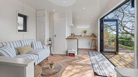 The open plan living area allows the outdoors in when the doors are open