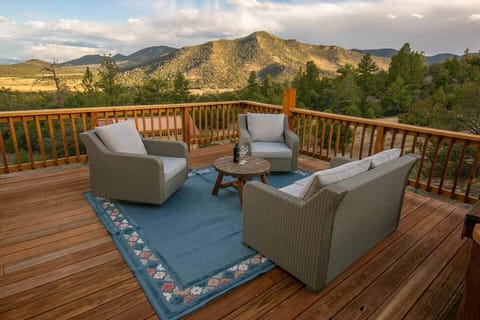 Deck, seating area. Spacious deck with comfy seating and sweeping Sangre de Cristo views.