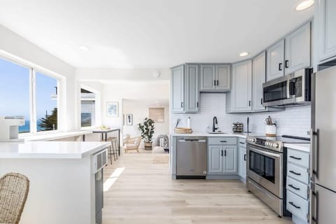 Open space with kitchen, living room and a fantastic view to the ocean