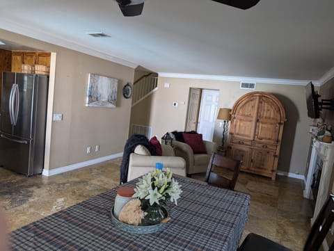 Family room and dining table. Queen aero bed with linens in Mexican cabinet