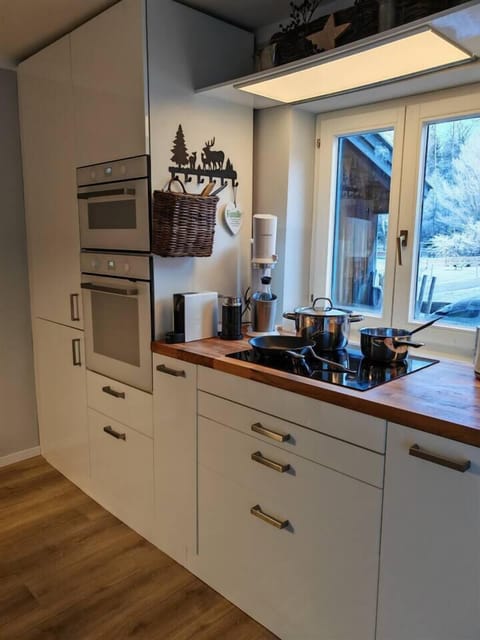 Kitchen with oven and microwave