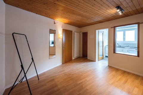 Entrance/hallway, with the oak ceiling and wooden doors this apartment has a real mountain feel 