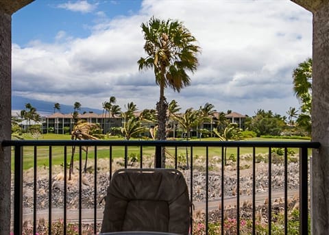 Enjoy serene golf course and tropical palm views right from your private lanai retreat.