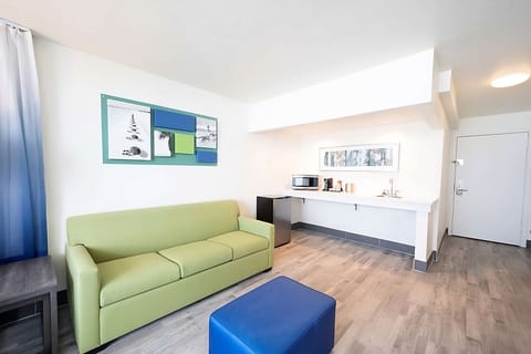 Living area. Exact unit will be assigned upon arrival. Views, colors, and decor may vary.