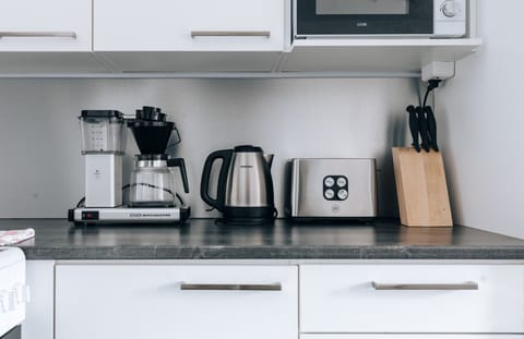 The apartment`s kitchen is well-equipped and includes an oven, full-size fridge-freezer, stove, and dishwasher.