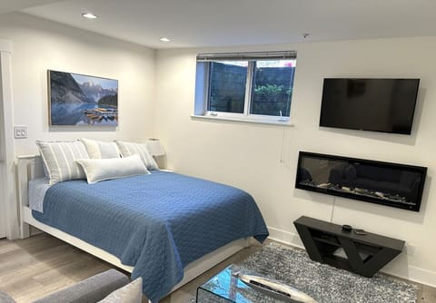 Enjoy TV or the fireplace from your comfy bed