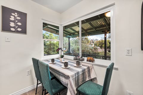 Savor your dining experience by the window, with a balcony breeze.