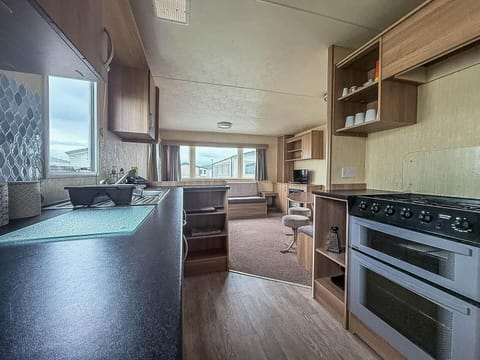 Cozy kitchen and living area with scenic window views