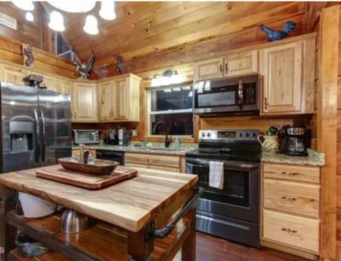 • Fully equipped kitchen with stove, microwave, and coffee maker