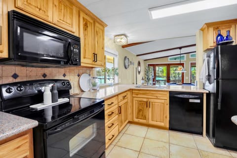 Unit A’s inviting kitchen offers ample space & every home comfort
