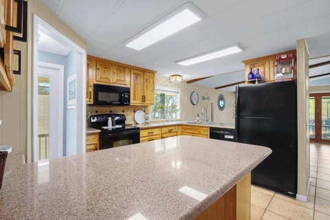 Unit A’s inviting kitchen offers ample space & every home comfort