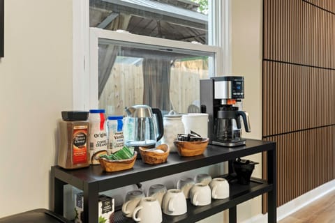 ☕Wake Up Right: Fully Stocked Coffee & Tea Bar Enjoy your morning brew with our deluxe coffee station featuring a Ninja drip coffee maker, hot water kettle, a variety of creamers, sweeteners, and an assortment of teas and instant coffee. Mugs and everythin