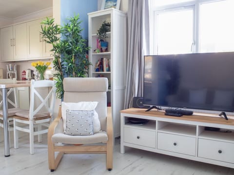 Furniture, Interior Design, Electronic Device, Flooring, Television, Floor, Wood, Room, Television Set, Living Room