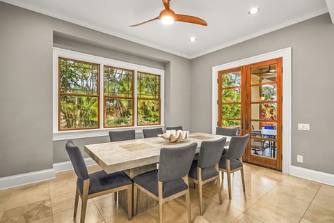 The open dining area flows effortlessly to the lanai for indoor or outdoor dining experiences