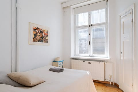 Wake up to soft, natural light filtering through large windows overlooking a quiet inner courtyard.