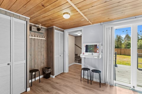 Arcade for entertainment and a convenient cloth hanger for added practicality.