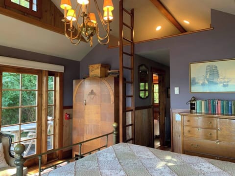 The combo bedroom/ living area has a fixed ladder to the additional loft area.