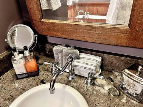 Bathroom sink area amenities.