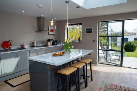 Kitchen with doors leading to terrace