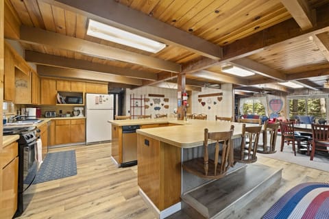Spacious, woodsy kitchen fully stocked with all the essentials—ready to help you cook up a feast for a crowd