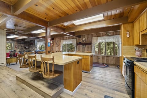 Diner-style U-shaped counter with built-in swivel stools—spin, snack, and stay awhile!