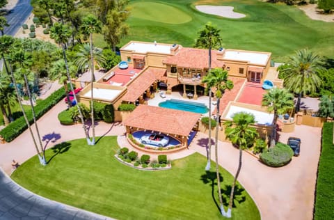 A stunning corner estate on the golf course that will leave you speechless! Featuring a circular driveway, 7-person jacuzzi, outdoor shower, snooker lounge, three spacious decks, and a private enclosed interior courtyard with a Roman-style heated pool—idea