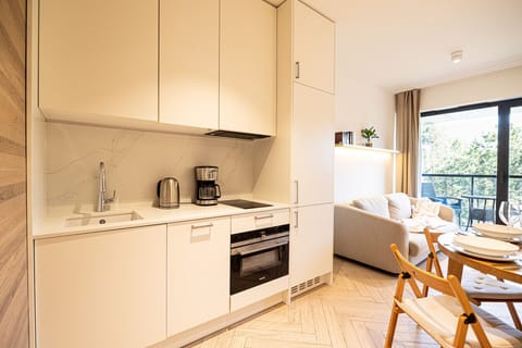 Bright, modern kitchen – dishwasher, coffee maker, everything you need included.