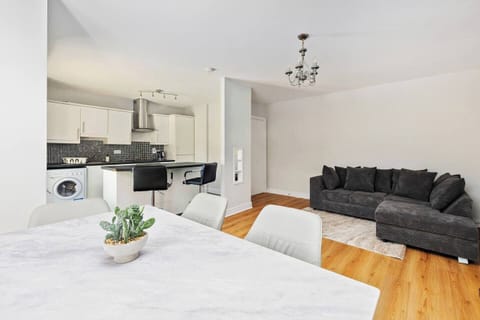 Modern living space with smart TV and comfy sofa, ideal for relaxing evenings.