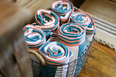 Spa Sanctuary: Vibrant, rolled towels await for your relaxation after a day of exploration!