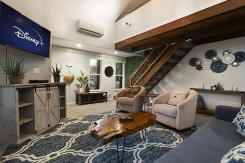 Comfortable living area with ample seating and entertainment setup.