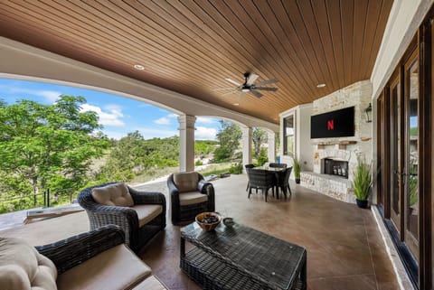 Patio affords the comforts of seating + a TV with beautiful Hill Country view!