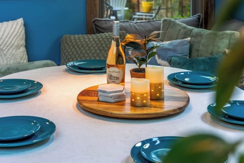 Bright, open space with stylish décor, inviting seating, and garden views