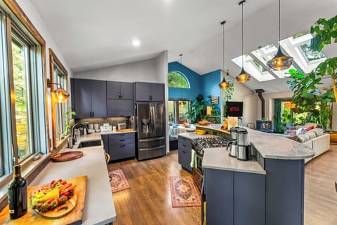 Cook and gather under skylights with scenic mountain views and vibrant decor!