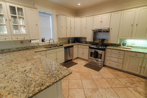 Gas oven and range, coffee maker, blender, toaster, & brand new utensils & spoon rest for all your cooking needs.