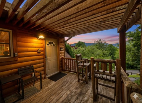 Rustic charm and tranquil moments await on this inviting porch.