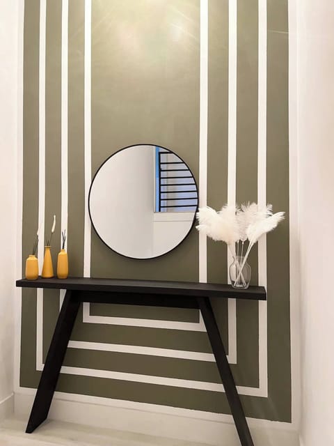 Chic Decor: Stylish accents throughout the home, including a modern console table with elegant decor, add a touch of sophistication to your stay.