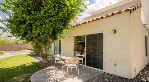 Unwind on your private patio with seating, designed for relaxation amidst the beautiful surroundings, making it perfect for families and multi-generational travelers.