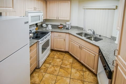 Experience culinary convenience in this Palm Desert property’s full kitchen, featuring modern appliances and ample counter space for family meals.
